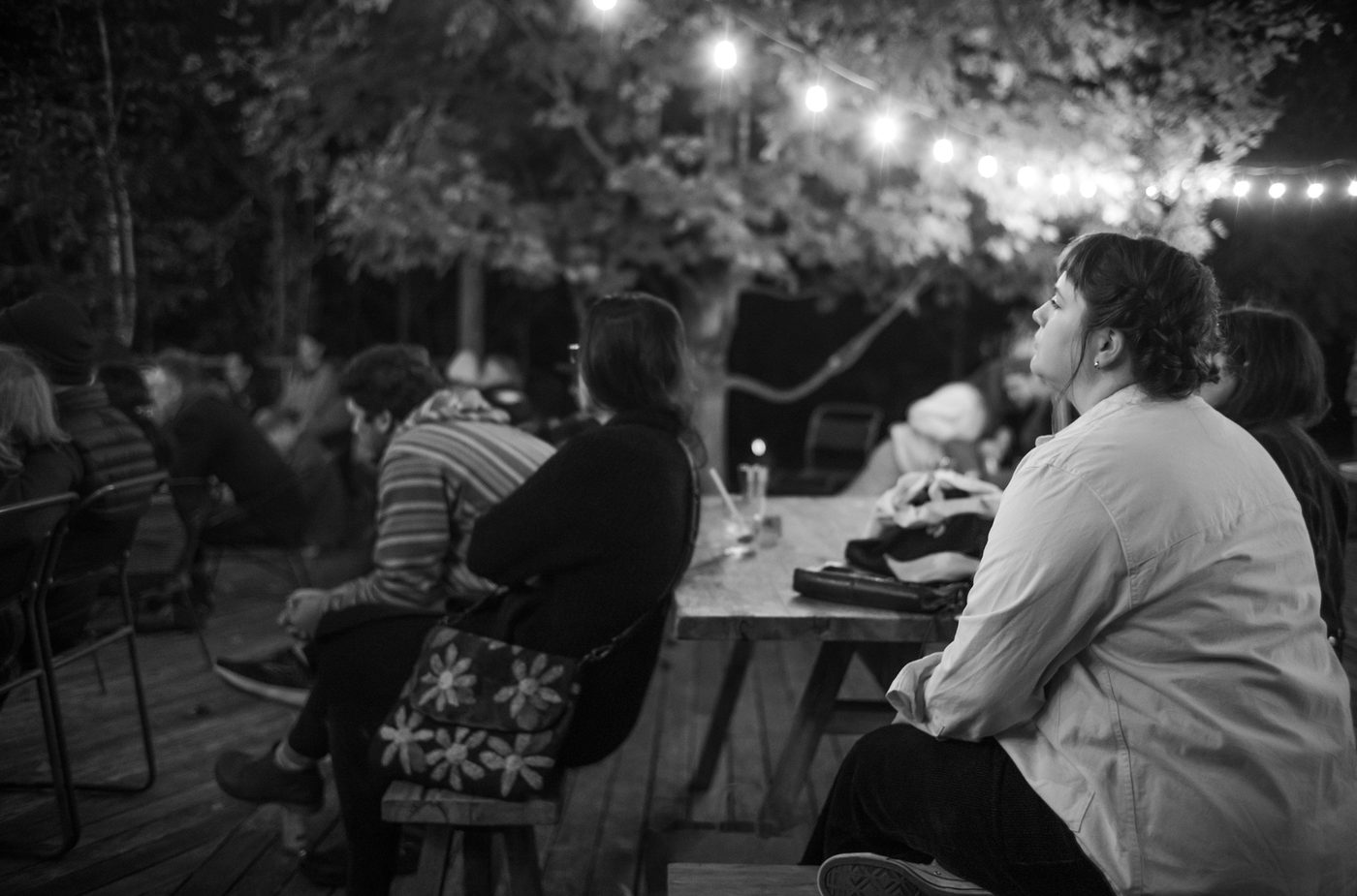 The audience watches Hiss Golden Messenger play at Tourists, part of the Sing For Your Slumber performer series.
