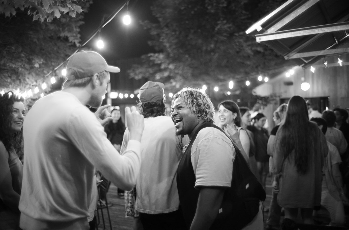 Billy Allen of Billie Allen + The Pollies talks to a fan after their performance at Tourists, part of the Sing For Your Slumber performer series.